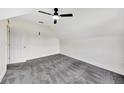Spacious bedroom with grey carpet and ceiling fan at 912 E 20Th Ave, Tampa, FL 33605