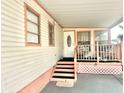 Steps leading to the entrance of a manufactured home with a covered porch at 9790 66Th N St # 248, Pinellas Park, FL 33782