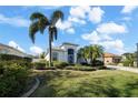 House exterior showcasing a palm tree and well-manicured lawn at 10038 Reagan Dairy Trl, Bradenton, FL 34212