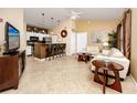 Living room with kitchen, island, and seating area at 10764 70Th Ave # 1303, Seminole, FL 33772