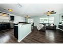 Modern kitchen with dark cabinetry and breakfast bar at 12290 68Th St, Largo, FL 33773