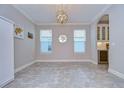 Elegant dining room featuring hardwood floors and a chandelier at 17721 Bright Wheat Dr, Lithia, FL 33547