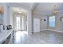 Bright and spacious entryway with tiled floors and a large door at 17721 Bright Wheat Dr, Lithia, FL 33547