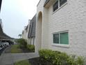 View of building exterior showcasing architectural details and landscaping at 214 Elmwood Cir # 214, Seminole, FL 33777