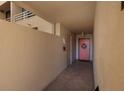 Interior hallway with pink door and white walls at 2795 Kipps Colony S Dr # 104, St Petersburg, FL 33707