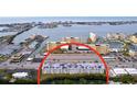 Aerial view showing a condo building near a waterway at 4455 Duhme Rd # 303, St Petersburg, FL 33708