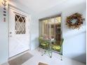 Small entryway with white door and patio seating at 4455 Duhme Rd # 303, St Petersburg, FL 33708