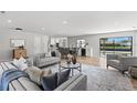 Spacious living room with large windows and modern furniture at 5215 Dover Ne St, St Petersburg, FL 33703
