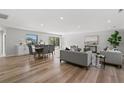 Open floor plan living area with hardwood floors and access to pool at 5215 Dover Ne St, St Petersburg, FL 33703