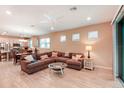 Open concept living room with sectional sofa and kitchen access at 6320 Cliveden Ct, Apollo Beach, FL 33572