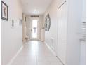 Bright and spacious entryway with tile flooring and neutral colors at 8203 Abalone Loop, Parrish, FL 34219