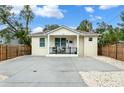 Front exterior of home featuring ample parking and a cozy front porch at 979 11Th S Ave, St Petersburg, FL 33705