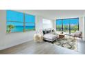 Living room with ocean view and comfortable seating at 100 Oakmont Ln # 309, Belleair, FL 33756