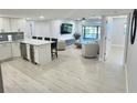 Open concept kitchen and living area, featuring modern appliances and flooring at 1001 S Bayshore Blvd # 205, Safety Harbor, FL 34695