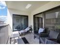 Relaxing balcony with outdoor furniture and ocean view at 12924 Gulf Blvd # 307, Madeira Beach, FL 33708