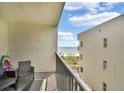 Balcony with ocean view and seating for two at 12924 Gulf Blvd # 307, Madeira Beach, FL 33708
