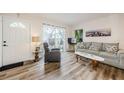 Living room with hardwood floors and access to patio at 1855 Bough Ave # B, Clearwater, FL 33760