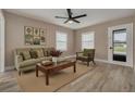 Bright living room with hardwood floors and a comfortable sitting area at 3111 Bay Ln, Clearwater, FL 33759