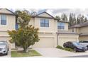 Two-story townhome with a two-car garage at 5152 Bay Isle Cir, Clearwater, FL 33760