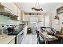 Kitchen features a dining area and white cabinetry at 704 E Broad St, Tampa, FL 33604