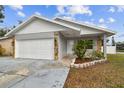 Well-maintained one-story home with a two-car garage and stone accents at 7101 69Th N St, Pinellas Park, FL 33781