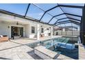 Relaxing pool and spa area with covered patio at 7678 Notched Pine Bnd, Wesley Chapel, FL 33545