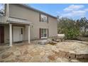 House exterior with a stone patio and water feature at 8575 Carey Rd, Lithia, FL 33547