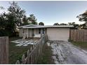 A charming single story home with a patio and fenced yard at 916 123Rd Ave, Tampa, FL 33612