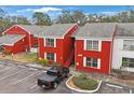 Red brick building aerial view, showing parking and surrounding area at 1290 83Rd N Ave # D, St Petersburg, FL 33702