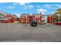 Red brick building exterior with parking lot at 1290 83Rd N Ave # D, St Petersburg, FL 33702