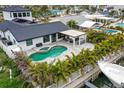 Luxury home with private pool, patio, and lush tropical landscaping at 16015 Redington Dr, Redington Beach, FL 33708