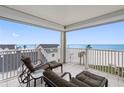 Relaxing balcony with ocean view and seating at 17980 Gulf Blvd # 501, Redington Shores, FL 33708