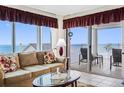 Living room boasts ocean view and comfy seating at 17980 Gulf Blvd # 501, Redington Shores, FL 33708