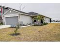 House exterior with palm trees and walkway leading to entrance at 2667 89Th Street E Cir, Palmetto, FL 34221