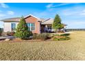 One story home with partial brick exterior and well-manicured lawn at 36511 Frazee Hill Rd, Dade City, FL 33523