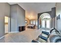 Spacious living room with a leather couch, offering views of the dining area and foyer at 4101 Concord Way, Plant City, FL 33566