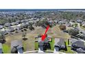 Aerial view showing a two-story house in a residential neighborhood at 4179 Bramblewood Loop, Spring Hill, FL 34609