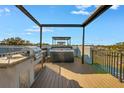 Relaxing rooftop deck with hot tub and outdoor kitchen at 460 87Th Avenue North, St Petersburg, FL 33702