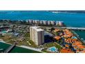 Aerial view of waterfront high-rise condo building and surrounding area at 4900 Brittany S Dr # 608, St Petersburg, FL 33715