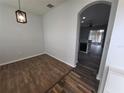 Dining area with wood-look floors and view of kitchen at 7041 Spotted Deer Pl, Riverview, FL 33569