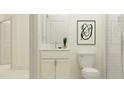 Clean bathroom with white vanity, toilet, and a walk-in shower at 7512 E 116Th St, Palmetto, FL 34221