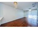 Empty dining room with hardwood floors and a chandelier at 10425 Westpark Preserve Blvd, Tampa, FL 33625