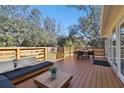 Relaxing deck with seating area and outdoor dining set at 13833 Vacation Ln, Odessa, FL 33556