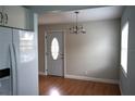 Bright dining area with hardwood floors and an elegant chandelier at 2202 Clubhouse Dr # 173, Sun City Center, FL 33573