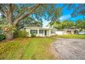 Charming house with mature trees and a spacious yard at 4113 S Drexel Ave, Tampa, FL 33611