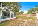 Spacious screened patio overlooking the backyard at 4113 S Drexel Ave, Tampa, FL 33611