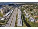 Aerial view of a waterfront community with multiple buildings and lush landscaping at 4455 Duhme Rd # 305, St Petersburg, FL 33708