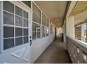 Building hallway with white doors and windows, featuring an exit sign at 4455 Duhme Rd # 305, St Petersburg, FL 33708