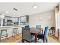 Bright dining area with wood table and four blue chairs at 4535 33Rd N Ave, St Petersburg, FL 33713