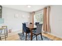 Dining room with wood table, four chairs, and light walls at 4535 33Rd N Ave, St Petersburg, FL 33713